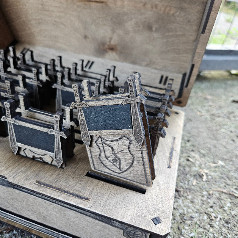 Wooden model of a castle with intricate details on a wooden base.