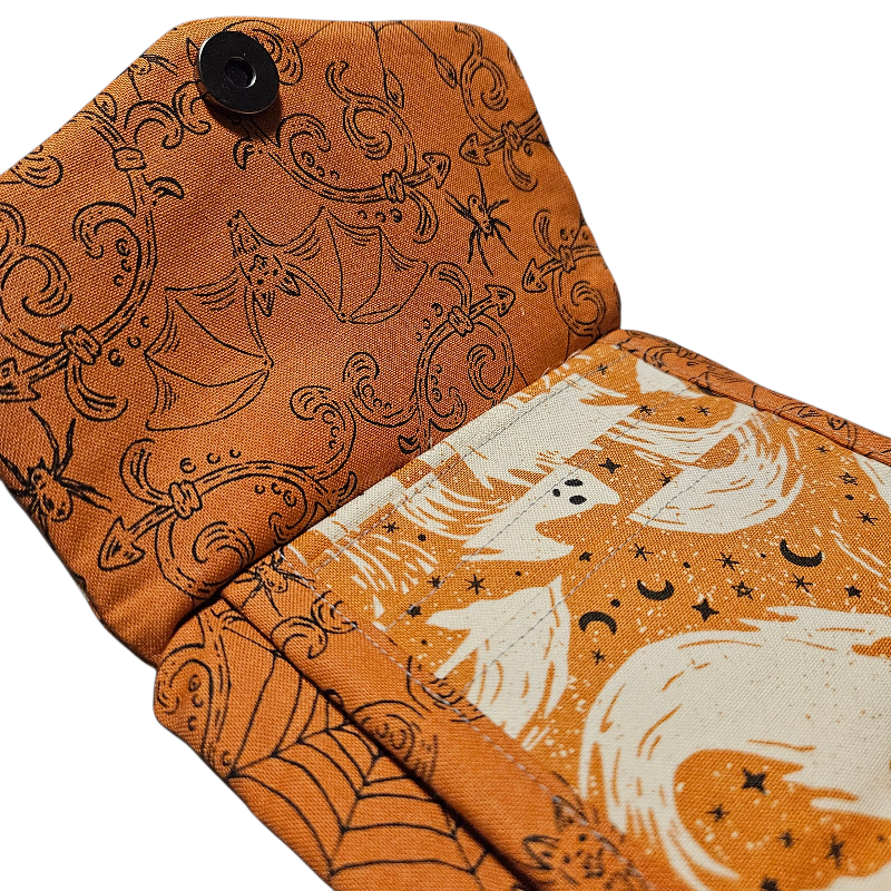 Two fabric swatches with Halloween-themed patterns on a white background.