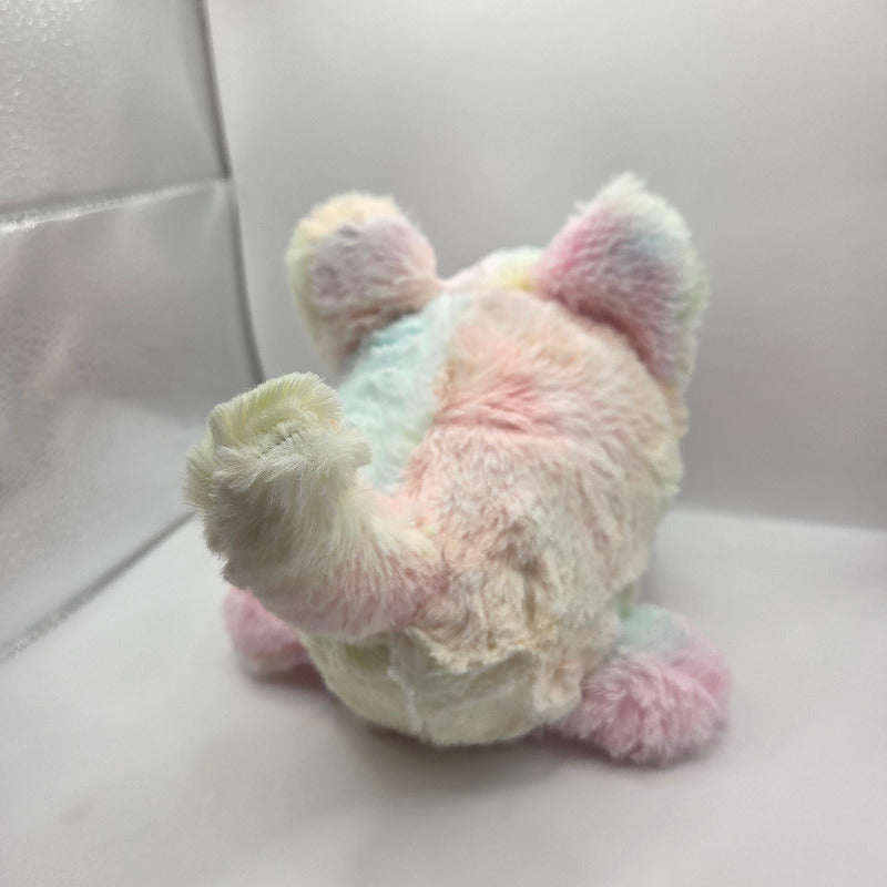 Pastel-colored teddy bear plush toy on a light background