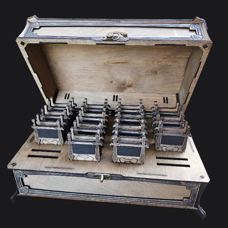 Wooden box with compartments containing small rectangular items on a concrete surface.