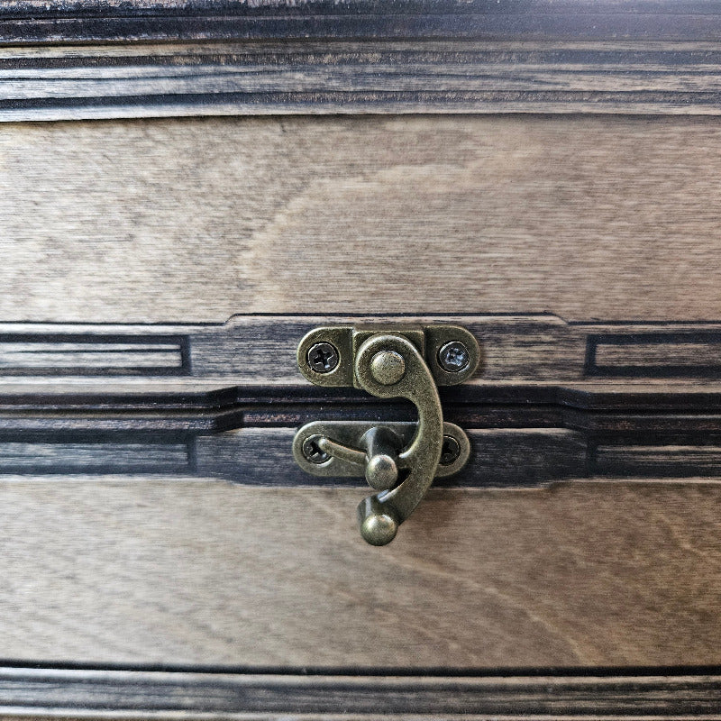 Close-up of a wooden surface with a metal latch