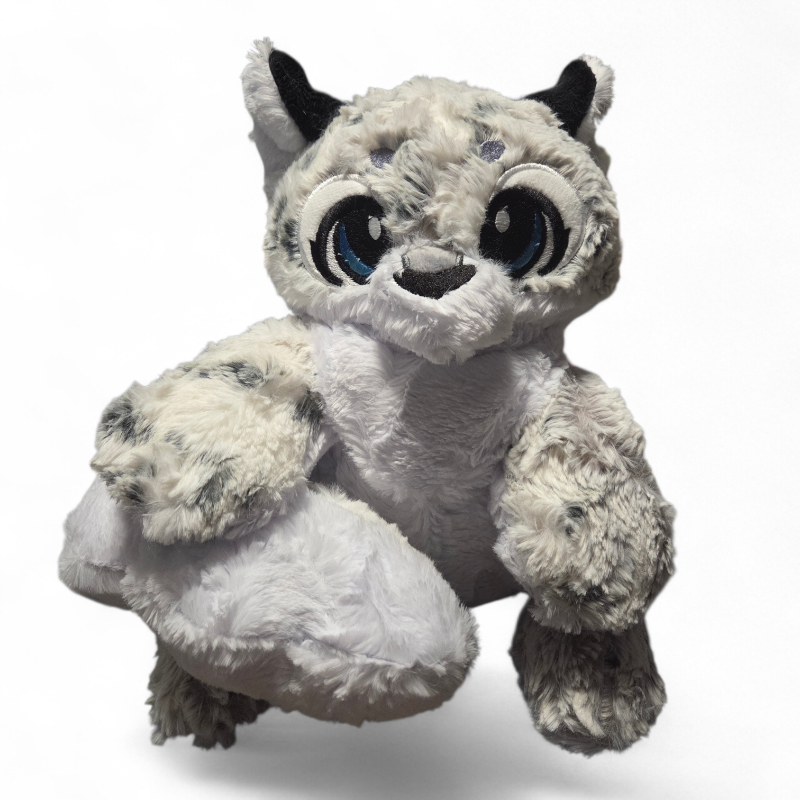 Plush toy resembling a white creature with black accents on a white background