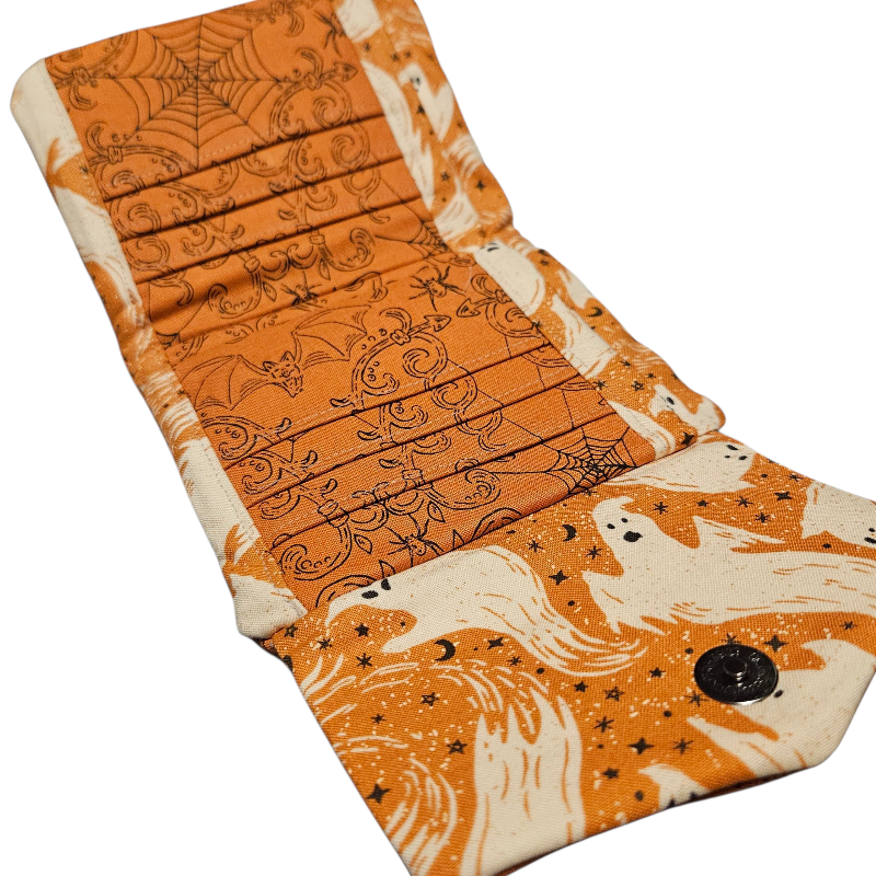 Folded fabric with Halloween-themed pattern on a white background