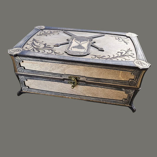 Wooden jewelry box with intricate carvings on a concrete surface